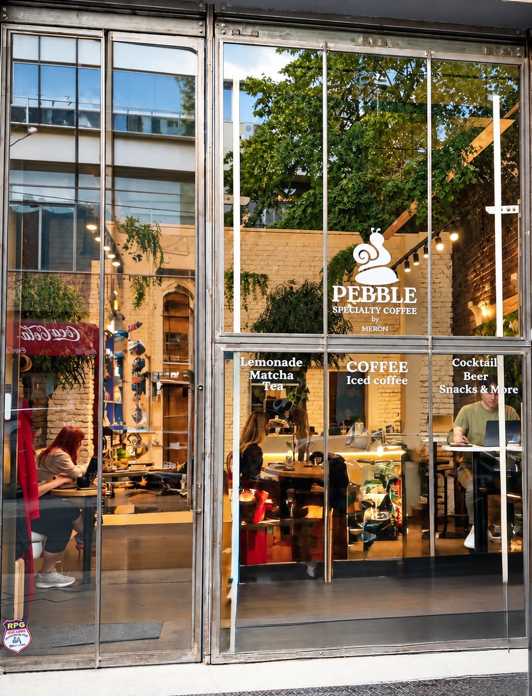 PEBBLE’s glass entrance with its original snail logo